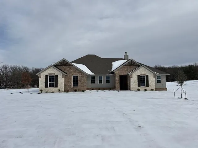 a big house with a big yard and large trees