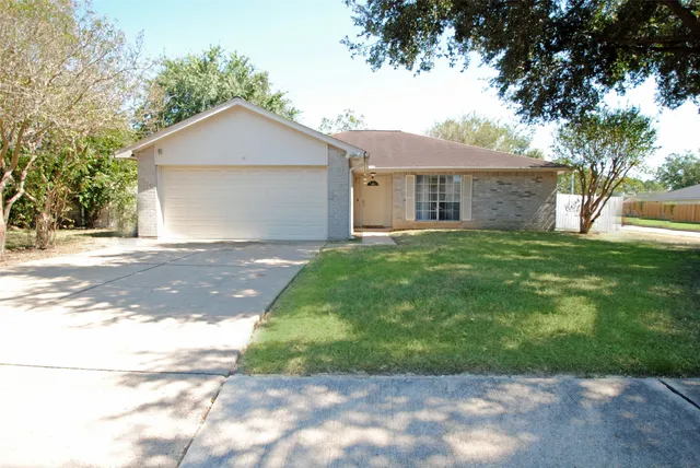 a front view of a house with yard
