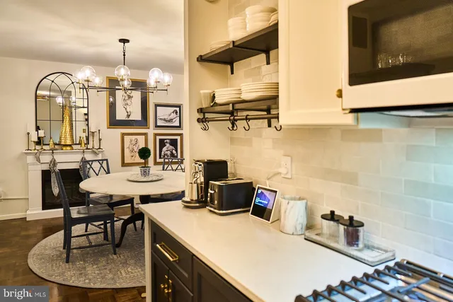 a kitchen with a table and chairs