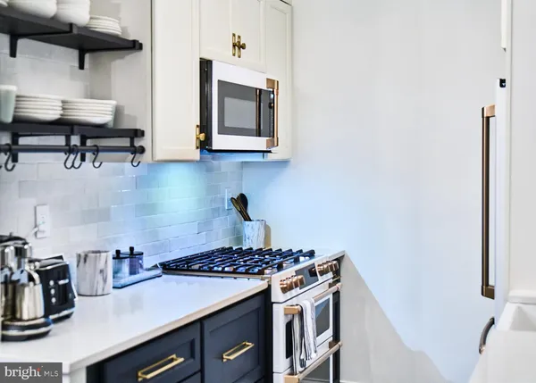 a kitchen with a stove and a sink