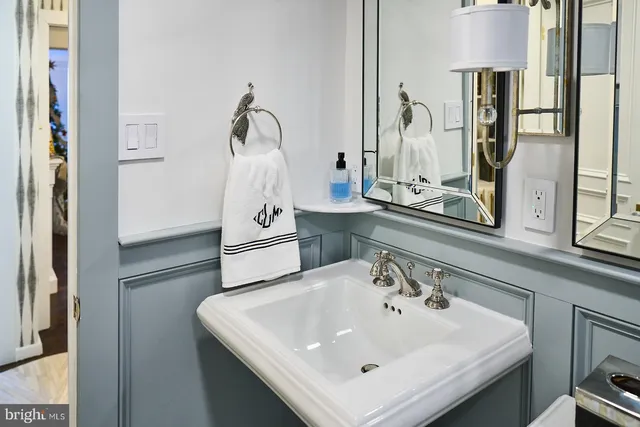 a bathroom with a sink a mirror and a shower