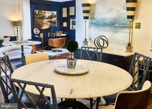 a dining room with furniture and wooden floor