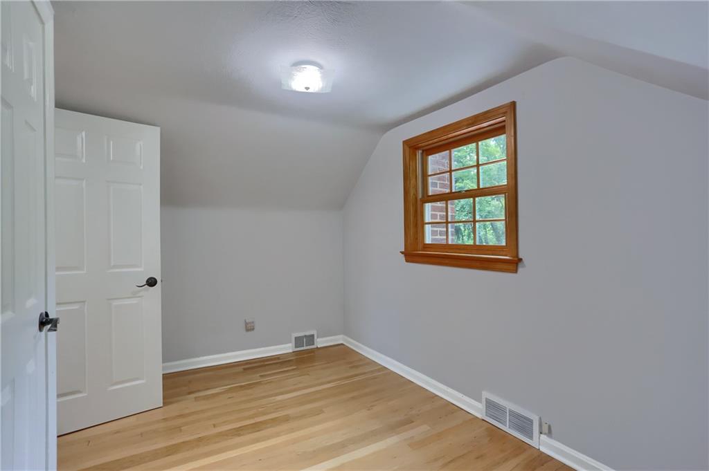 836 Harmony Road Pittsburgh, PA 15237 - Photo 43 of 46 a view of an empty room with wooden floor and a window