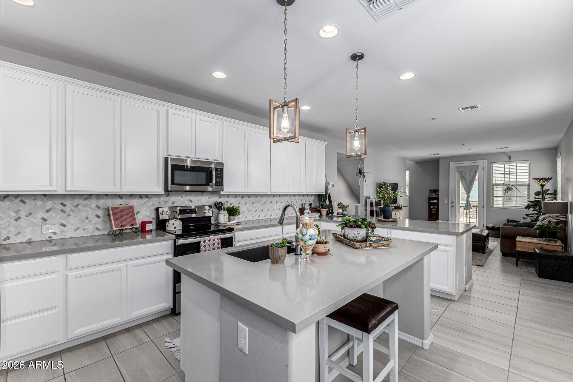 1747 East Chelsea Lane Gilbert, AZ 85295 - Photo 13 of 30 a kitchen with sink cabinets and microwave