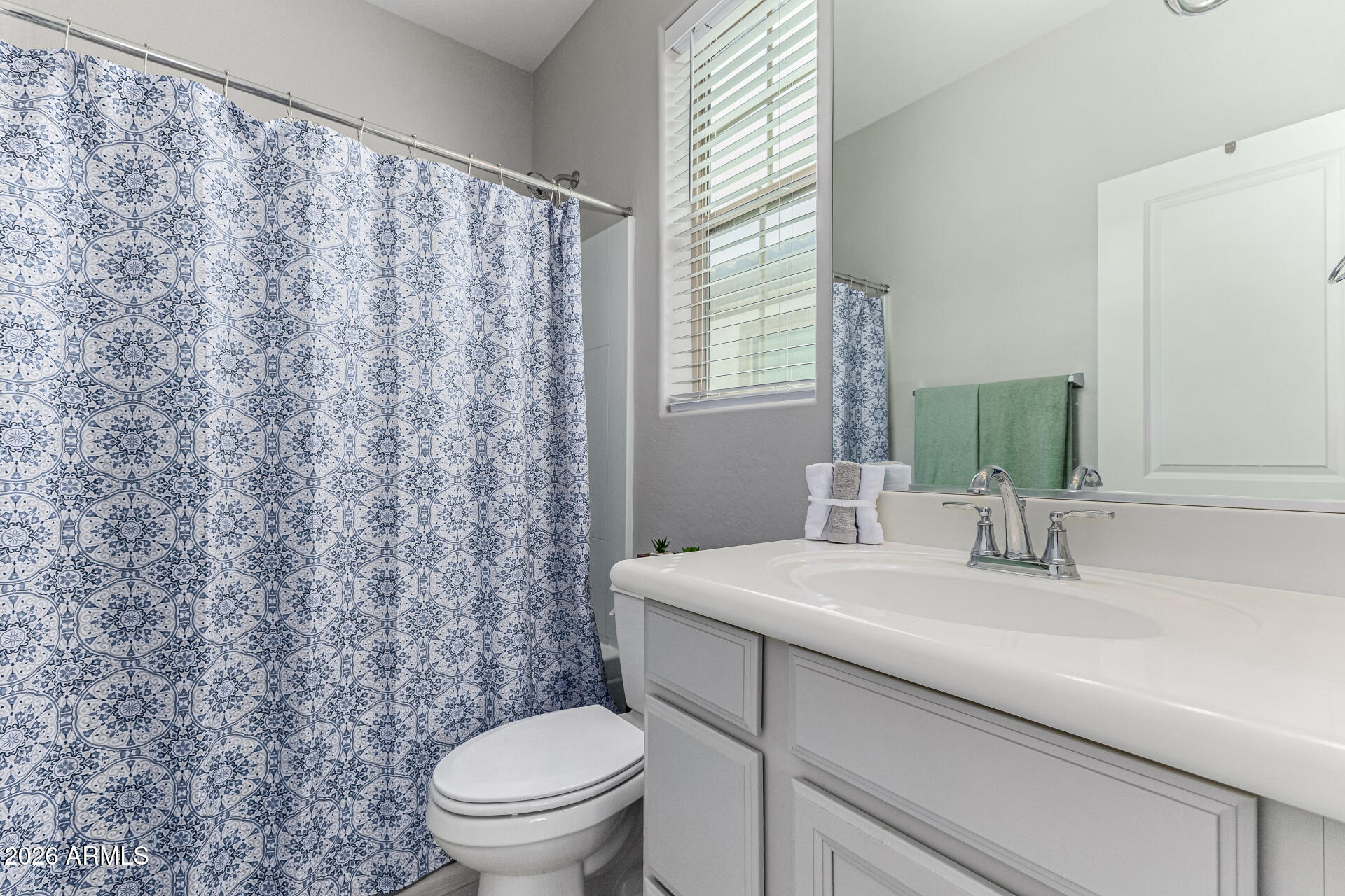 1747 East Chelsea Lane Gilbert, AZ 85295 - Photo 23 of 30 a bathroom with a sink toilet and a mirror