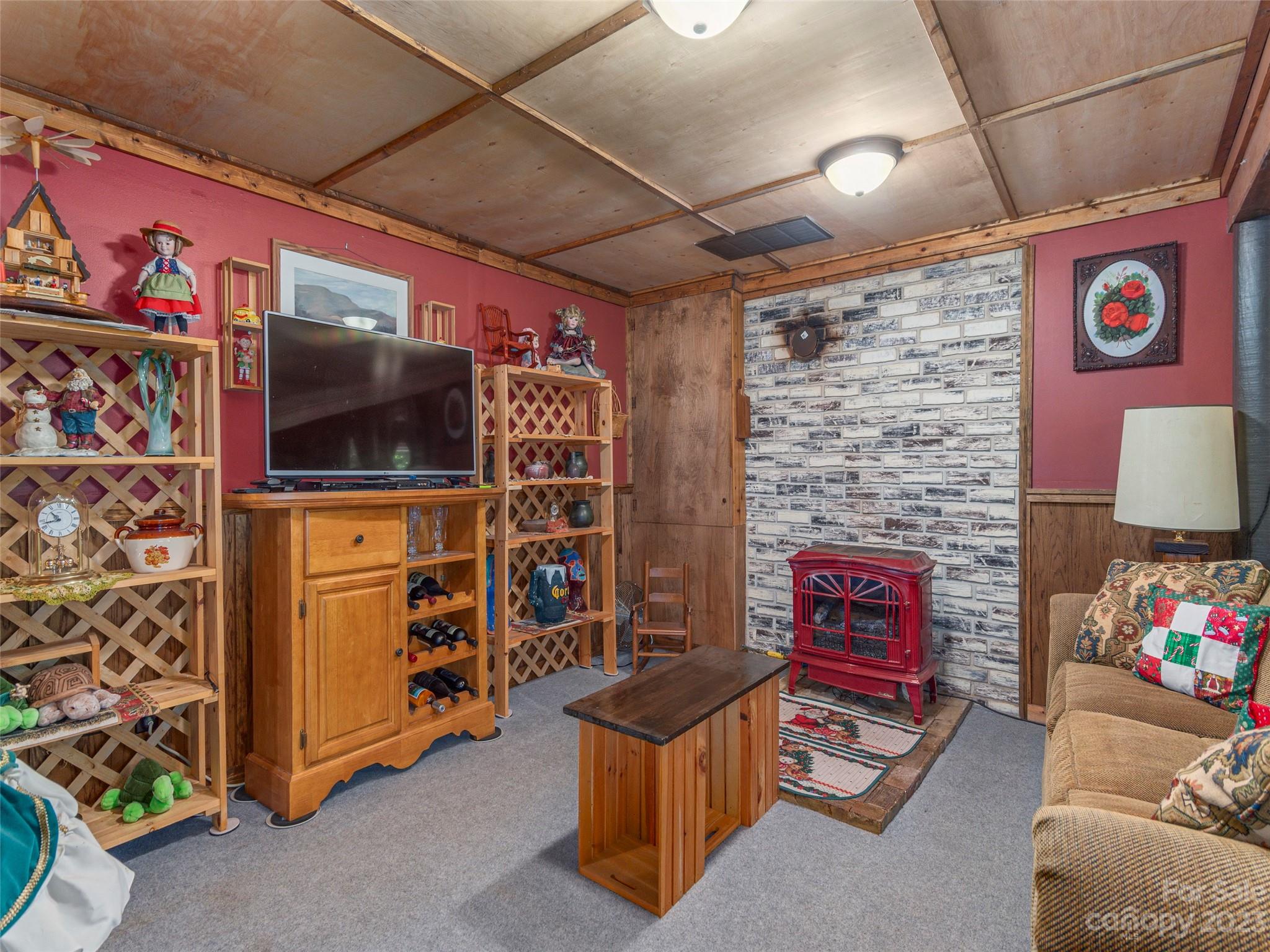 291 Dickinson Drive Clyde, NC 28721 - Photo 15 of 27 a living room with furniture and a flat screen tv