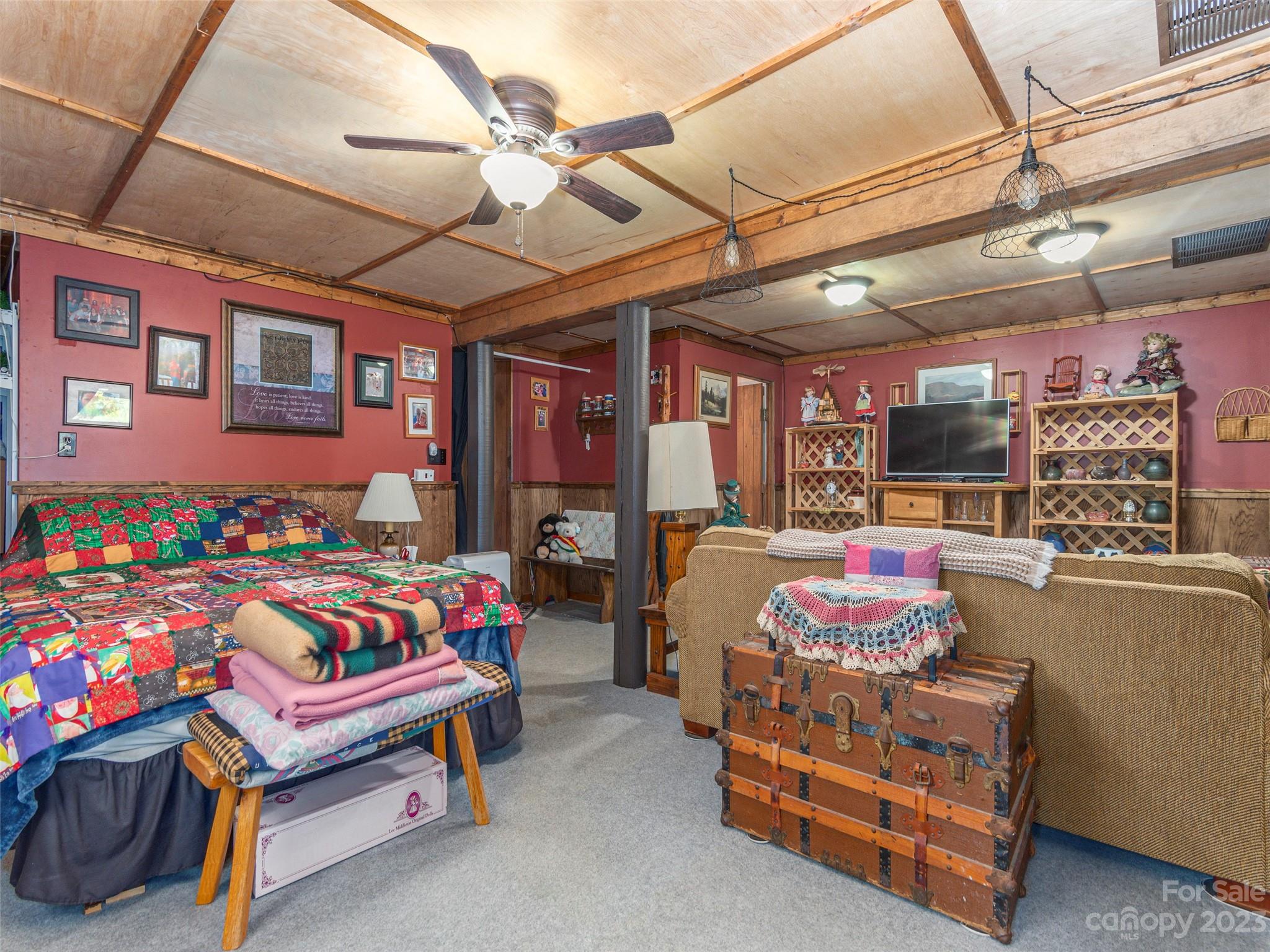 291 Dickinson Drive Clyde, NC 28721 - Photo 17 of 27 a bedroom with furniture and a chandelier