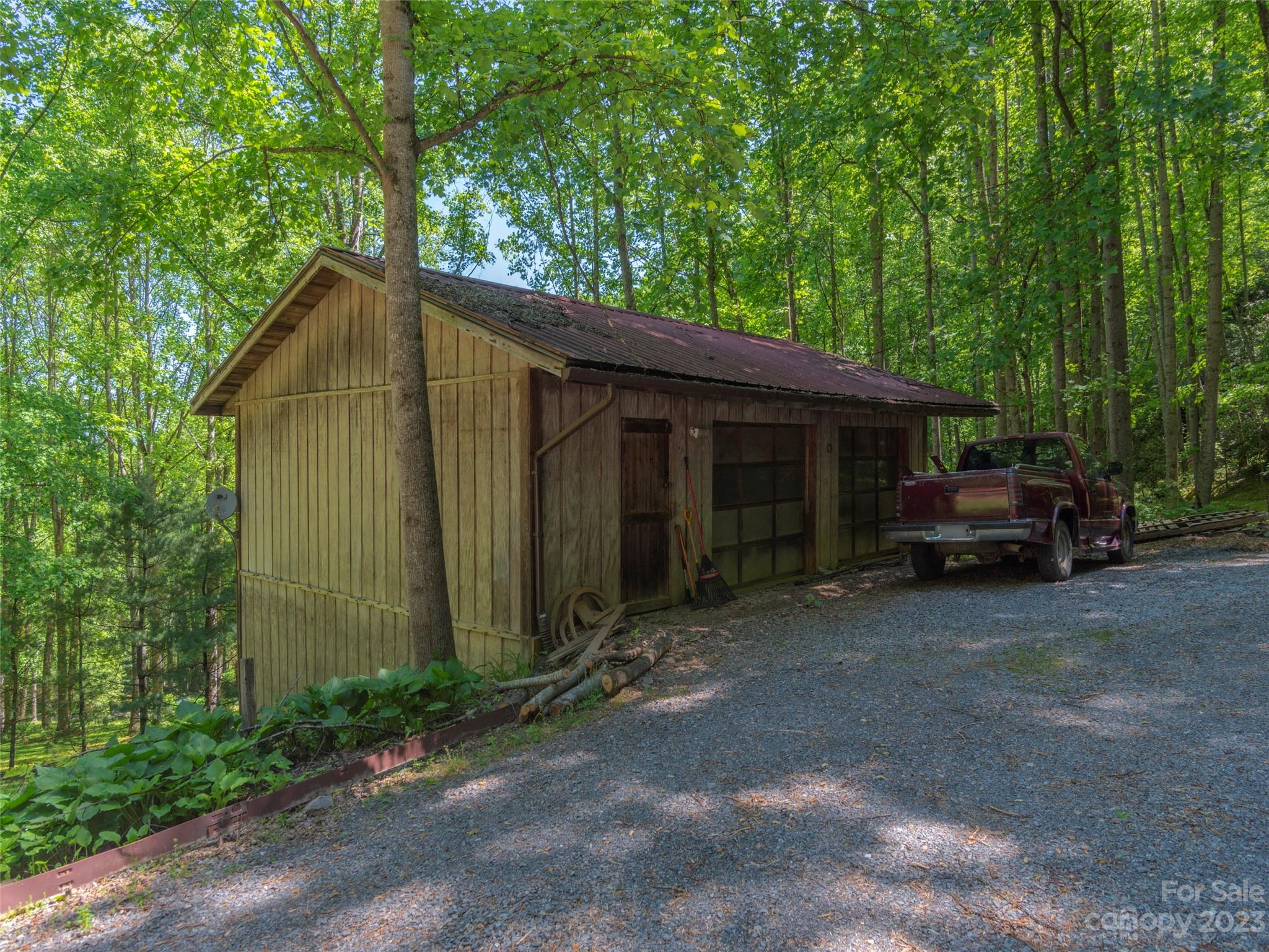 291 Dickinson Drive Clyde, NC 28721 - Photo 25 of 27 a view of a car parked in front of house