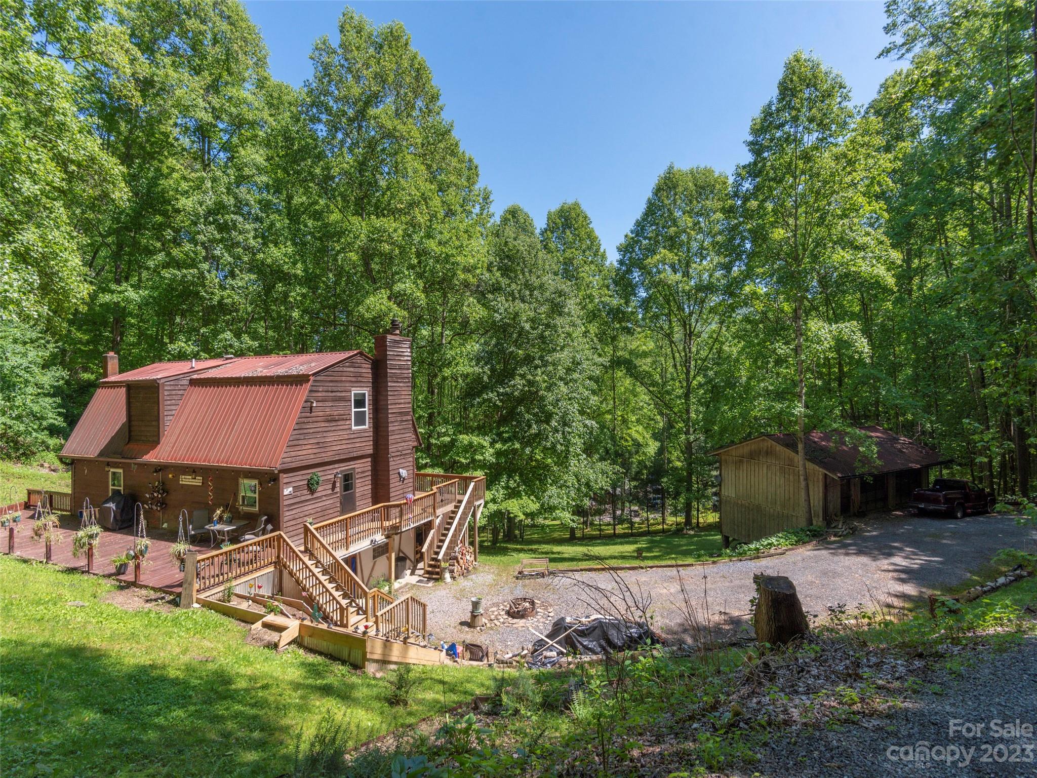 291 Dickinson Drive Clyde, NC 28721 - Photo 27 of 27 a view of a house with backyard and sitting area
