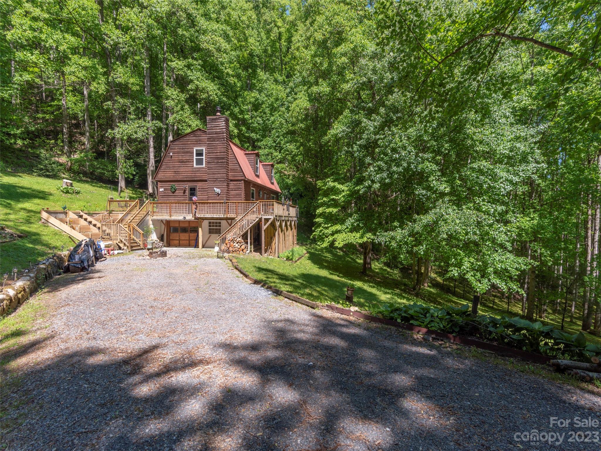 291 Dickinson Drive Clyde, NC 28721 - Photo 3 of 27 a aerial view of a house with a yard