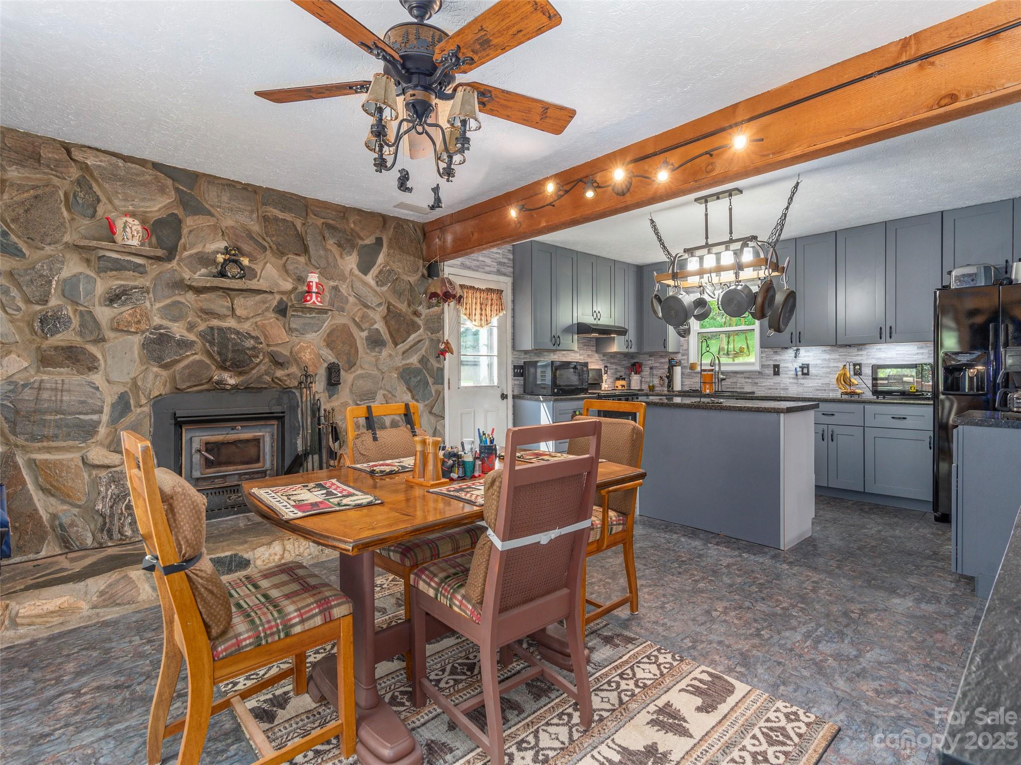 291 Dickinson Drive Clyde, NC 28721 - Photo 8 of 27 a view of a dining room with furniture and chandelier