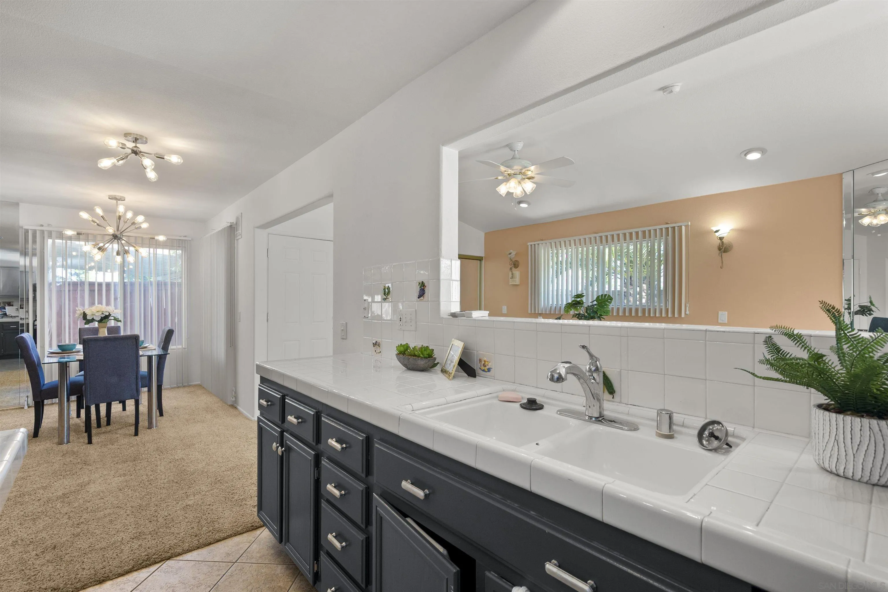4815 Ebony Ridge Road San Diego, CA 92102 - Photo 19 of 45 a spacious bathroom with a double vanity sink a mirror and a bathtub