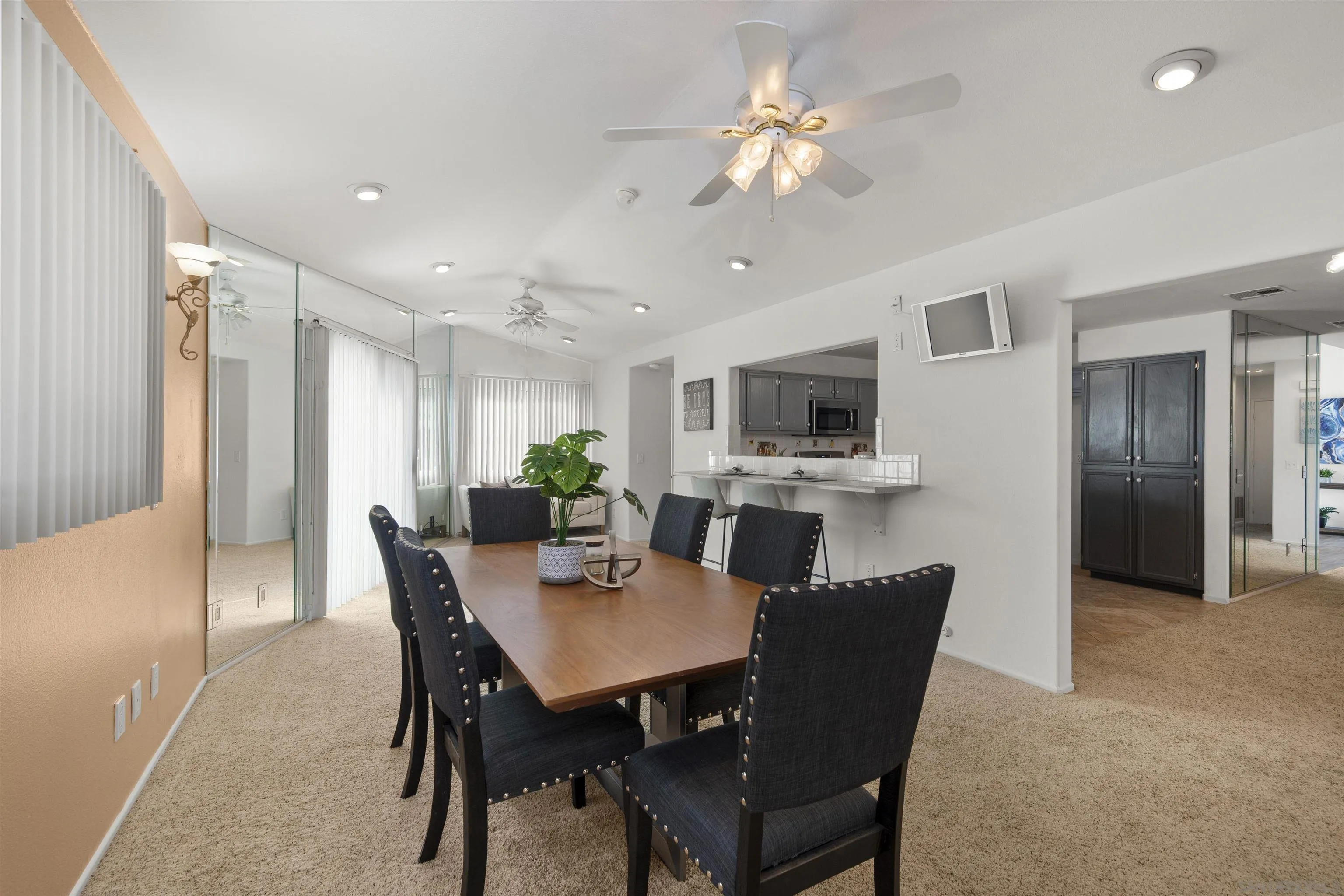 4815 Ebony Ridge Road San Diego, CA 92102 - Photo 20 of 45 a view of a dining room with furniture and a chandelier