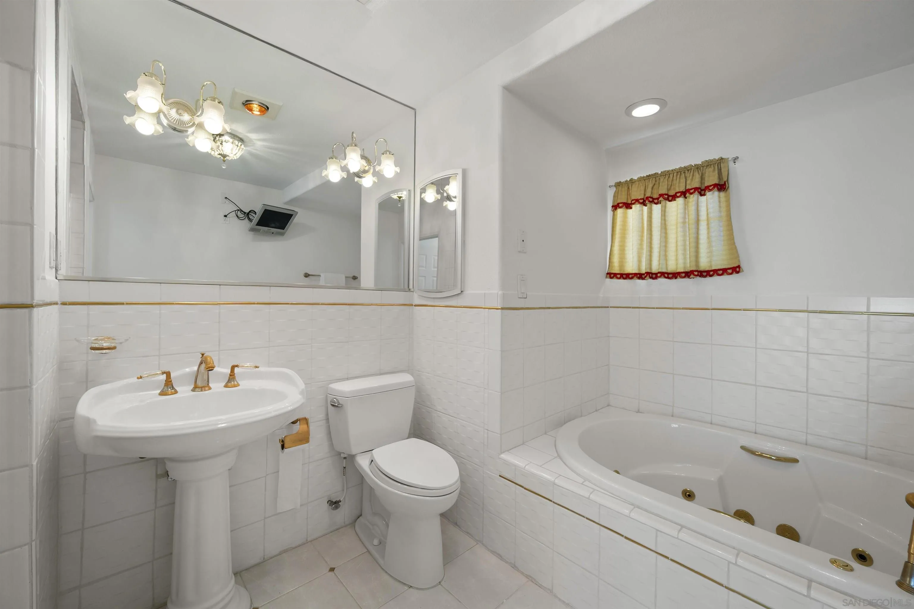 4815 Ebony Ridge Road San Diego, CA 92102 - Photo 25 of 45 a bathroom with a sink mirror and toilet