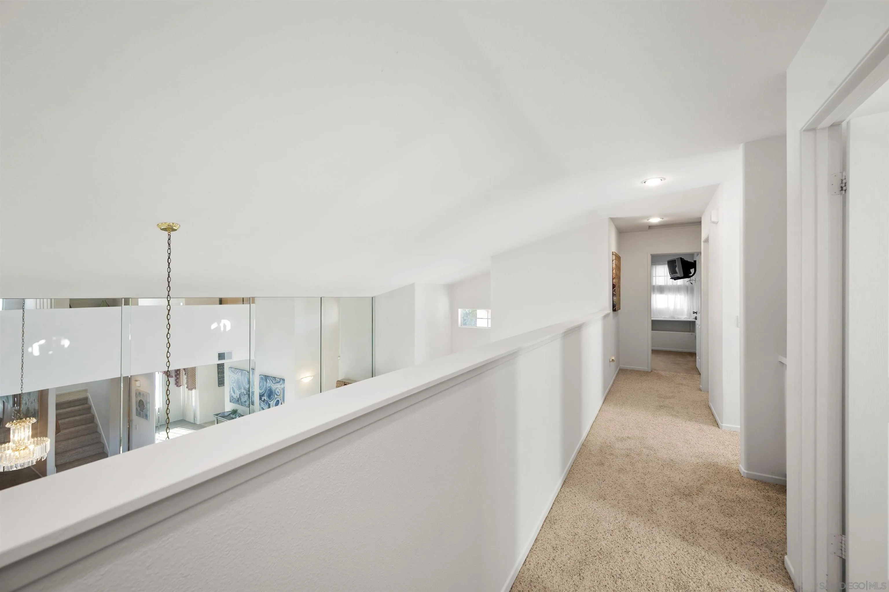 4815 Ebony Ridge Road San Diego, CA 92102 - Photo 27 of 45 a view of a kitchen with a sink and mirror