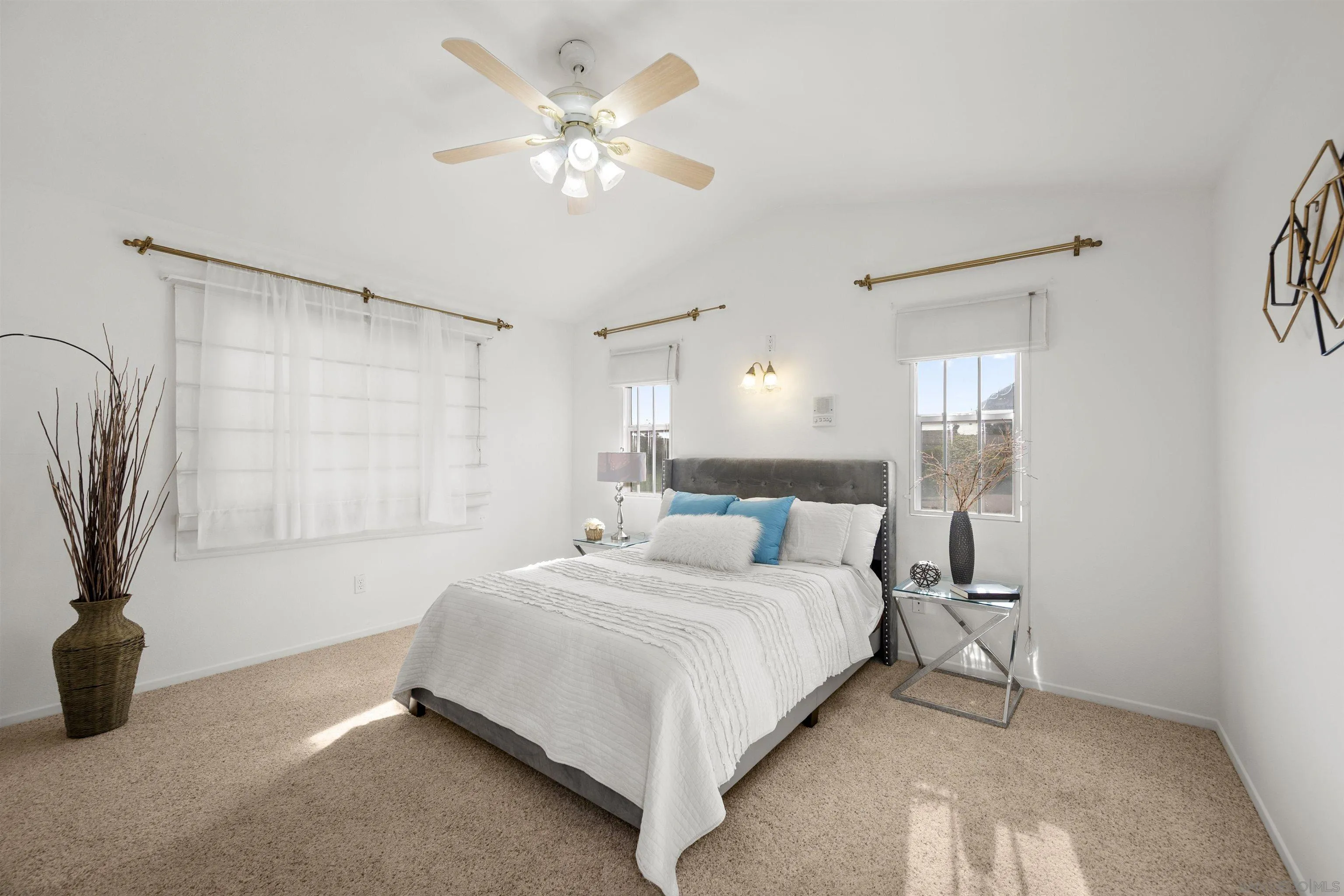 4815 Ebony Ridge Road San Diego, CA 92102 - Photo 28 of 45 a bedroom with a bed and a chandelier