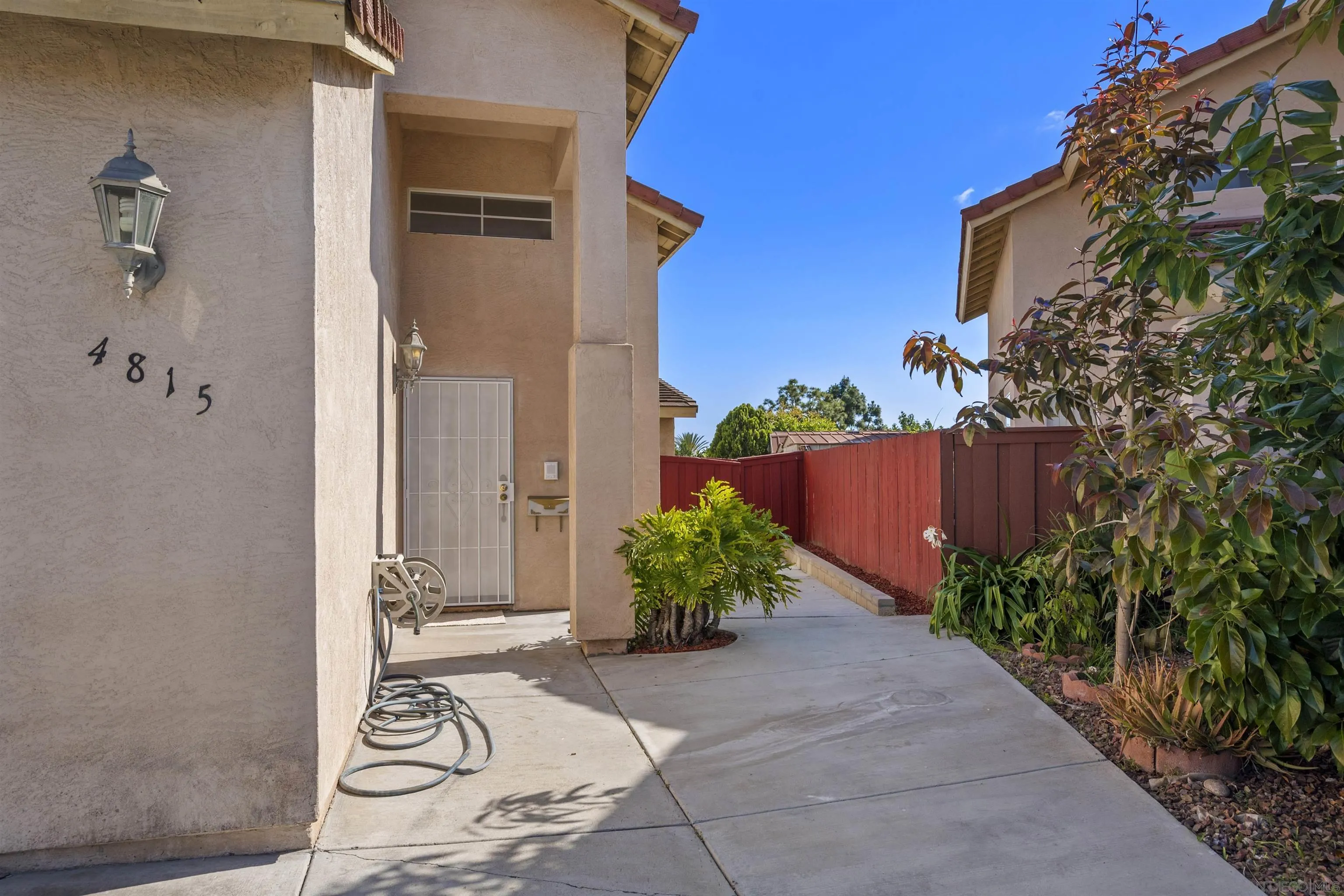 4815 Ebony Ridge Road San Diego, CA 92102 - Photo 3 of 45 a view of a house with a backyard