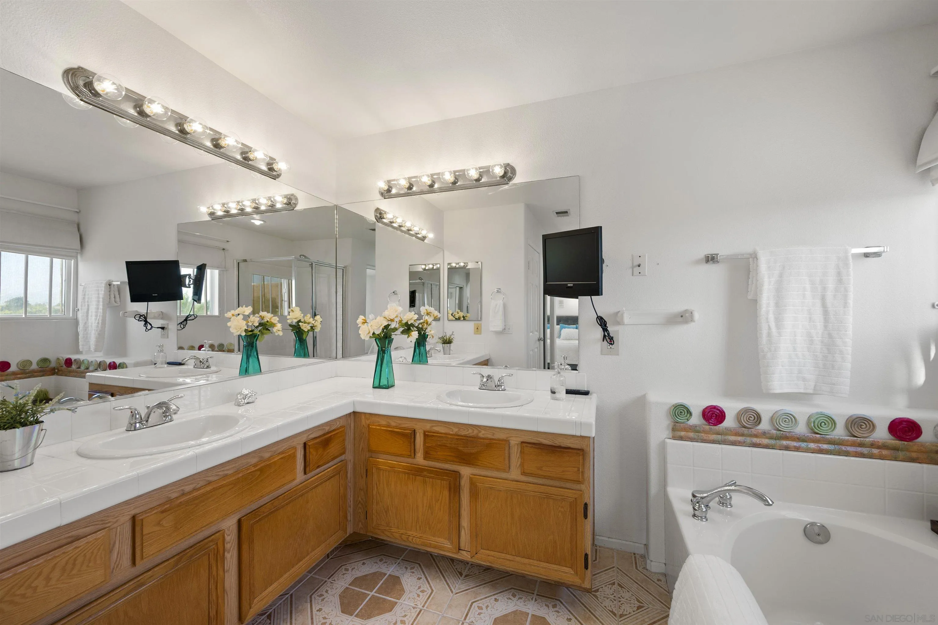 4815 Ebony Ridge Road San Diego, CA 92102 - Photo 31 of 45 a bathroom with a sink double vanity and a mirror