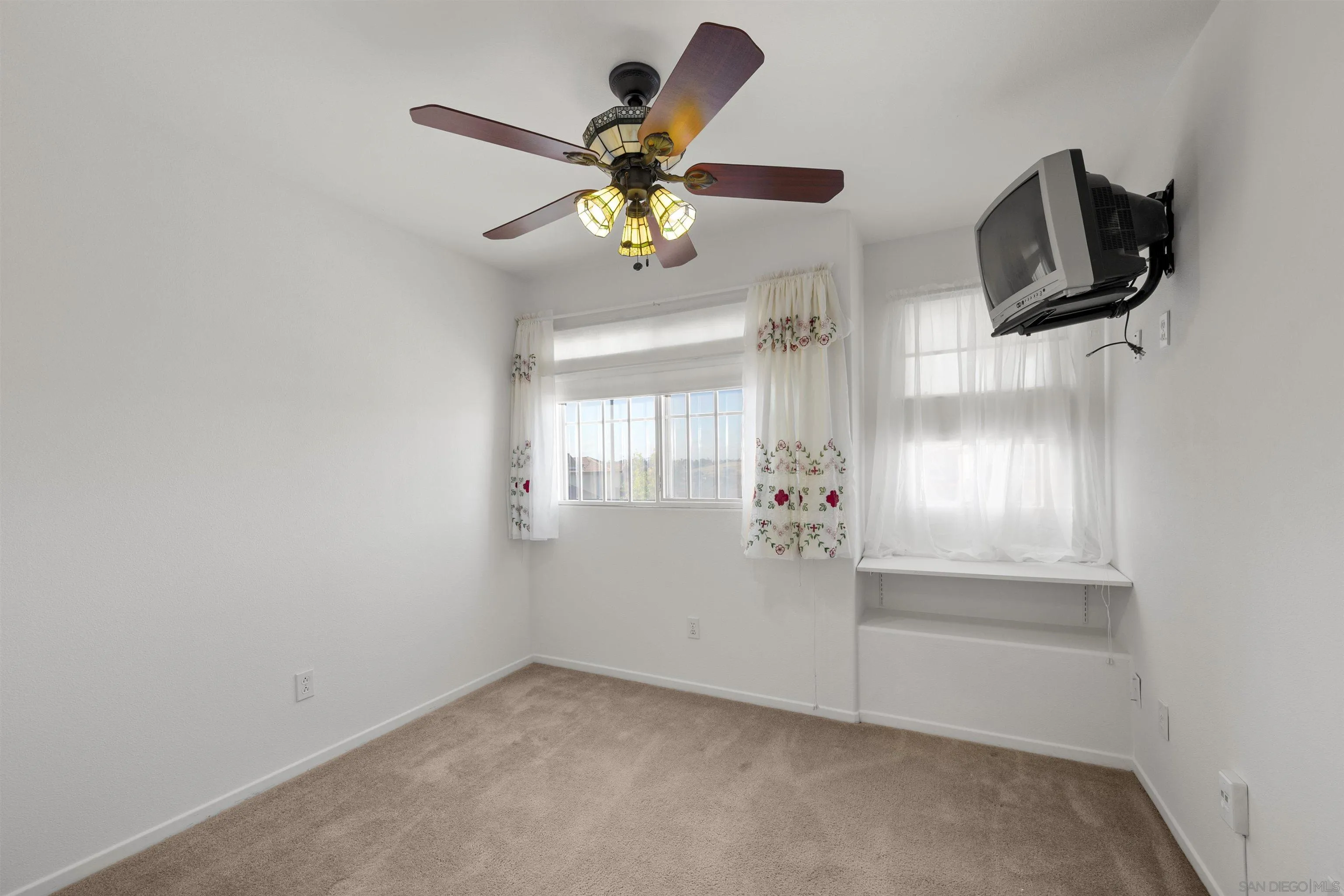 4815 Ebony Ridge Road San Diego, CA 92102 - Photo 34 of 45 an empty room with windows and flat screen tv