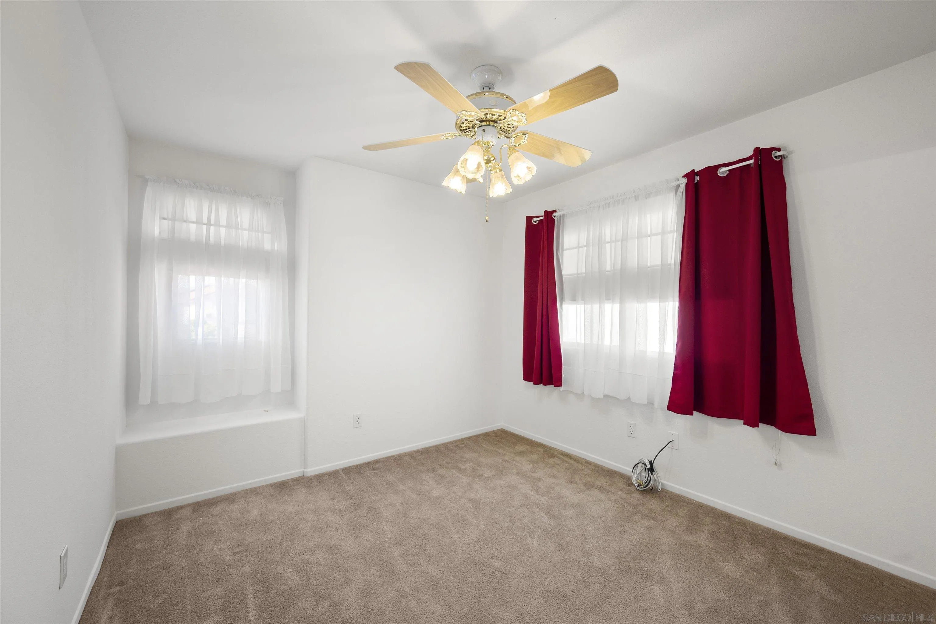 4815 Ebony Ridge Road San Diego, CA 92102 - Photo 36 of 45 a view of a livingroom with a fan and window