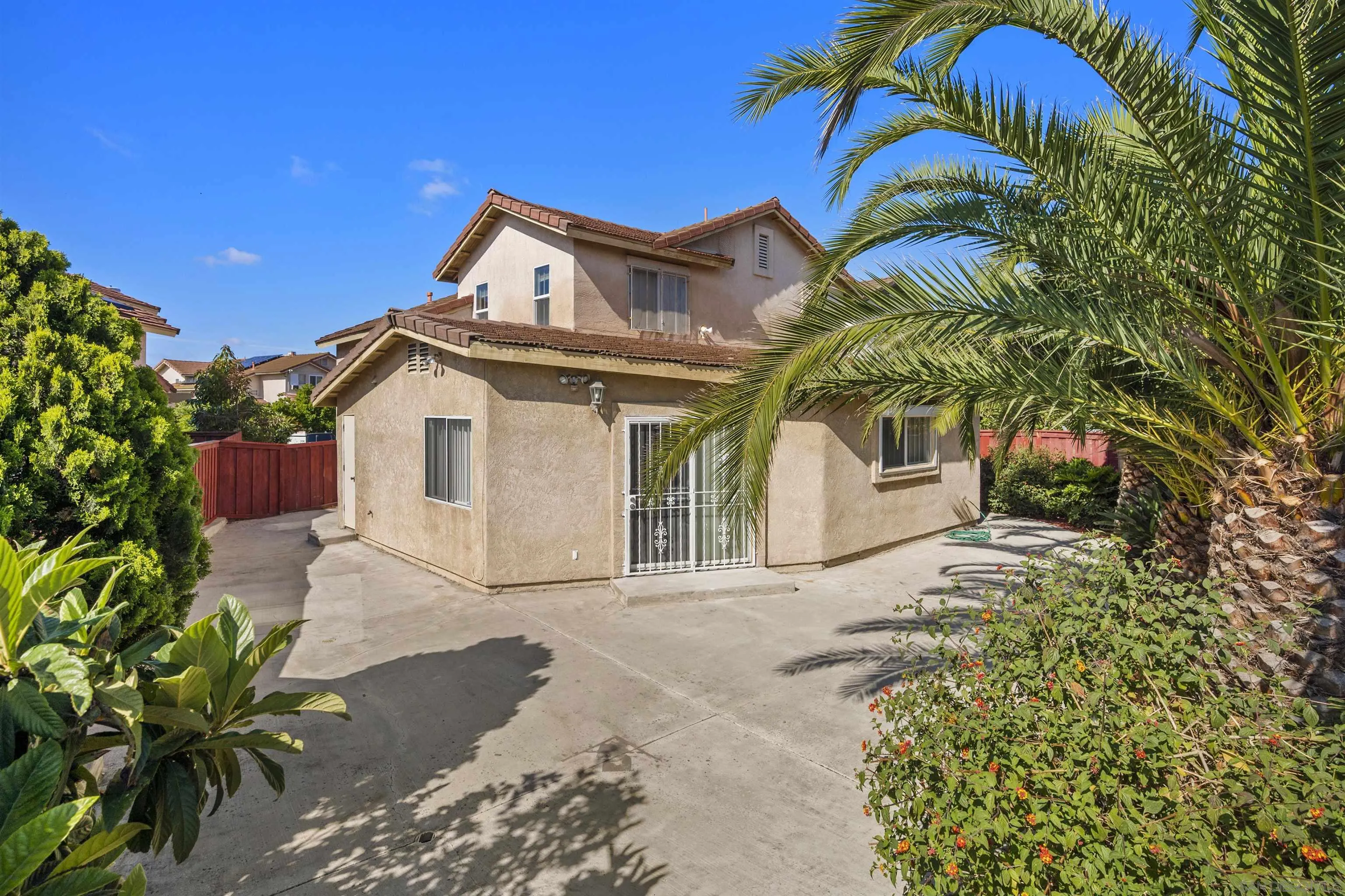 4815 Ebony Ridge Road San Diego, CA 92102 - Photo 42 of 45 a view of a house with a yard and potted plants