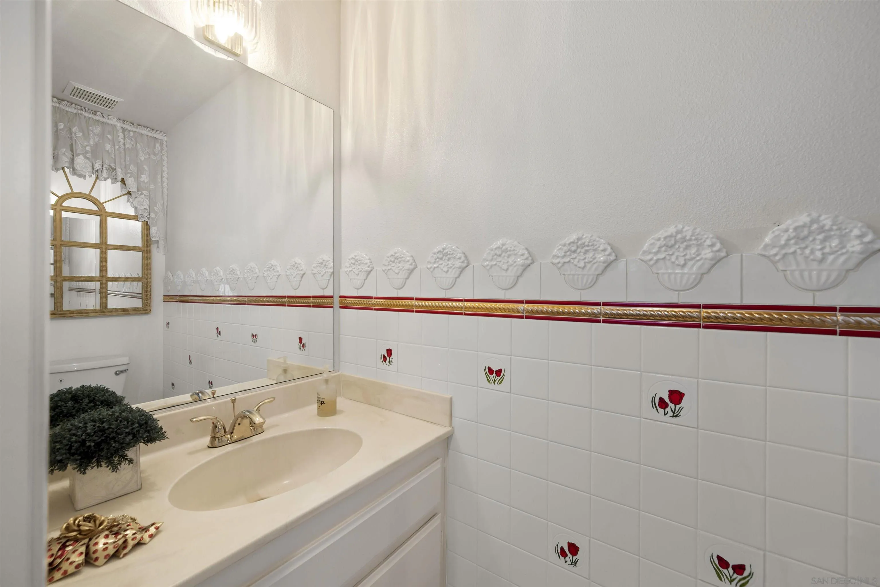 4815 Ebony Ridge Road San Diego, CA 92102 - Photo 10 of 45 a bathroom with a sink and a mirror