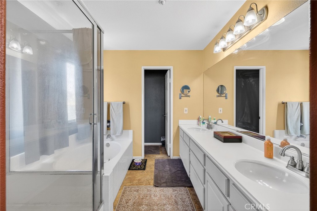 807 Lomond Drive Riverside, CA 92508 - Photo 31 of 47 Master bath with dual sinks, stall shower, soaking tub, and private toilet room at the back.