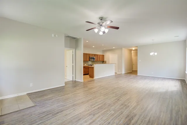 a view of a kitchen with a sink and a window