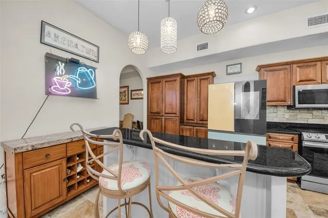 a living room with furniture and large windows