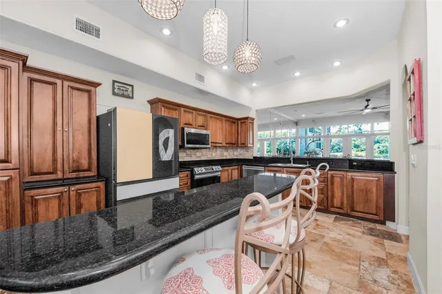 a bedroom with a bed a large window and flat screen tv