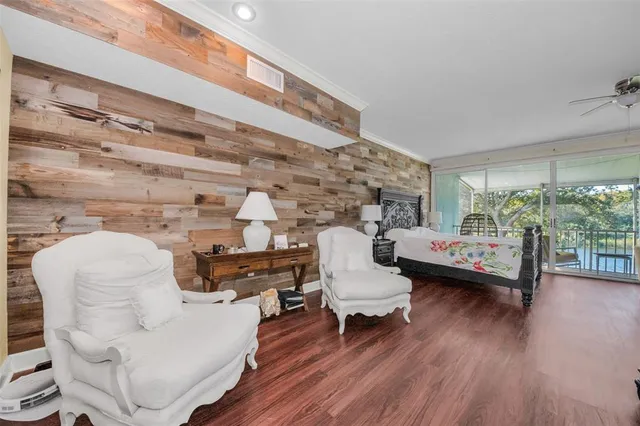 a view of a livingroom with furniture and a window