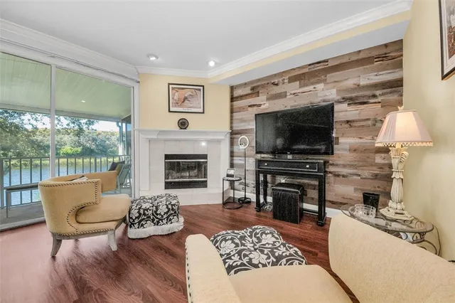 a living room with furniture a rug and white walls