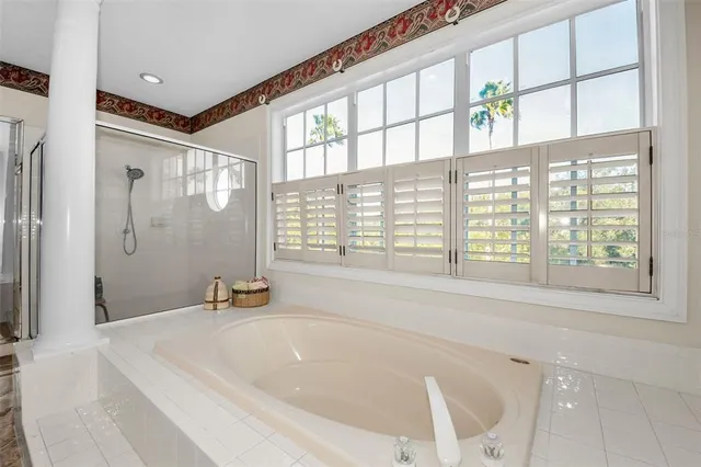 a view of a chairs and table in the balcony