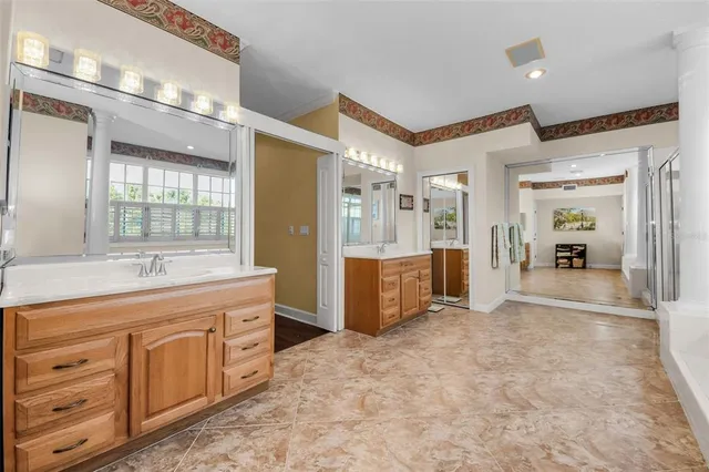 a view of a lake with houses in the back