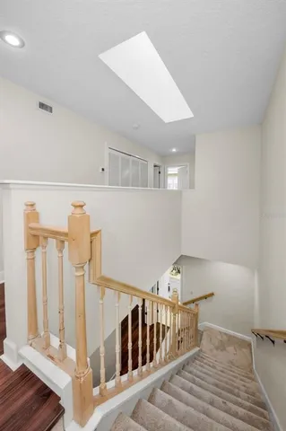 a view of a backyard with plants and lake view