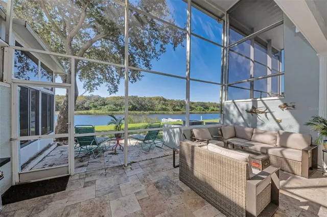 a front view of a house with a yard glass top table and chairs