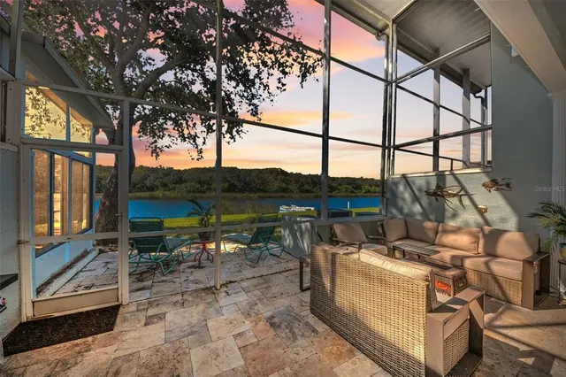 a view of a swimming pool with a patio