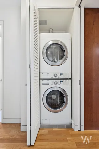 a view of a hallway with washer and dryer