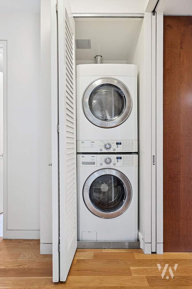 800 West End Avenue, Unit 12B Manhattan, NY 10025 - Photo 18 of 19 a view of a hallway with washer and dryer