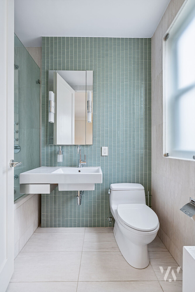 800 West End Avenue, Unit 12B Manhattan, NY 10025 - Photo 9 of 19 a bathroom with a toilet a sink and mirror