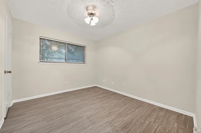 a view of a house with backyard sitting area and garden