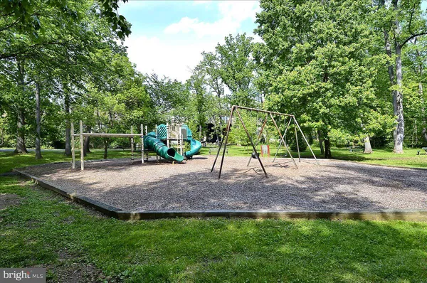 a view of outdoor space with deck and green space