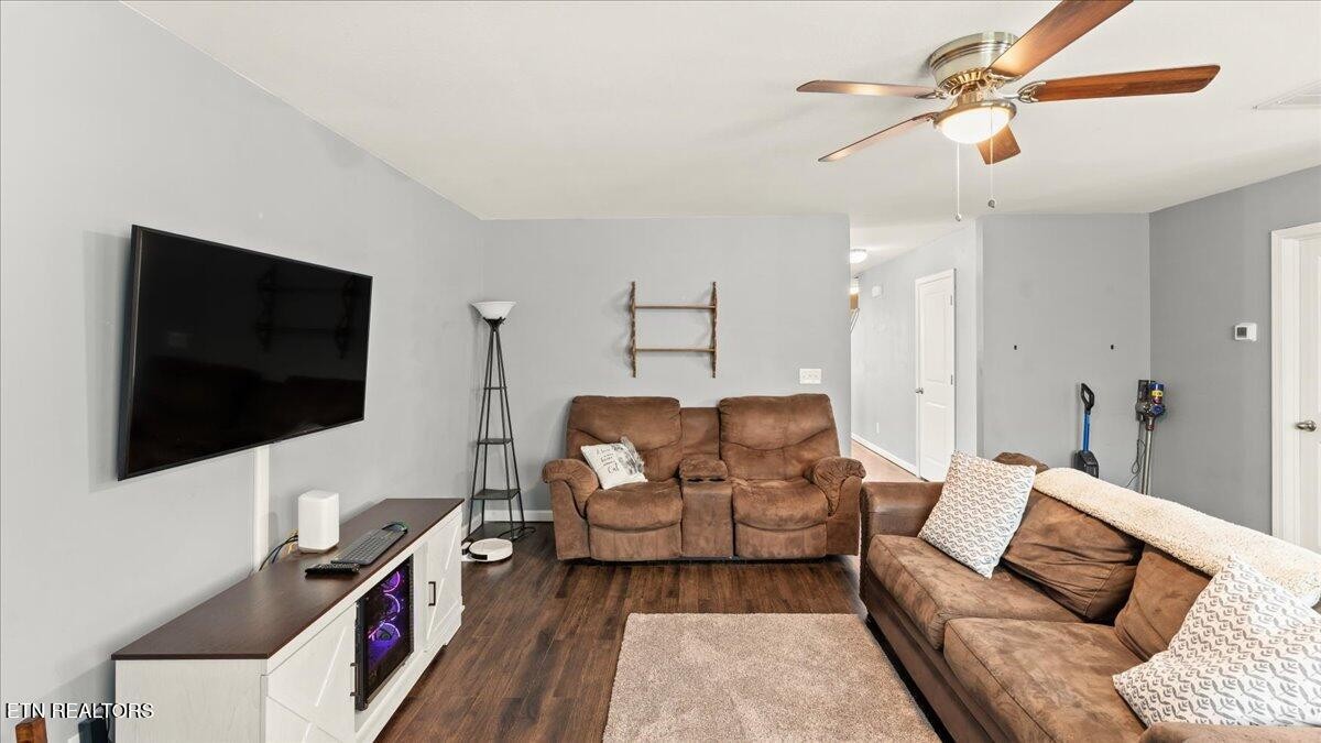 1816 River Poppy Road Mascot, TN 37806 - Photo 13 of 52 a living room with furniture and a flat screen tv