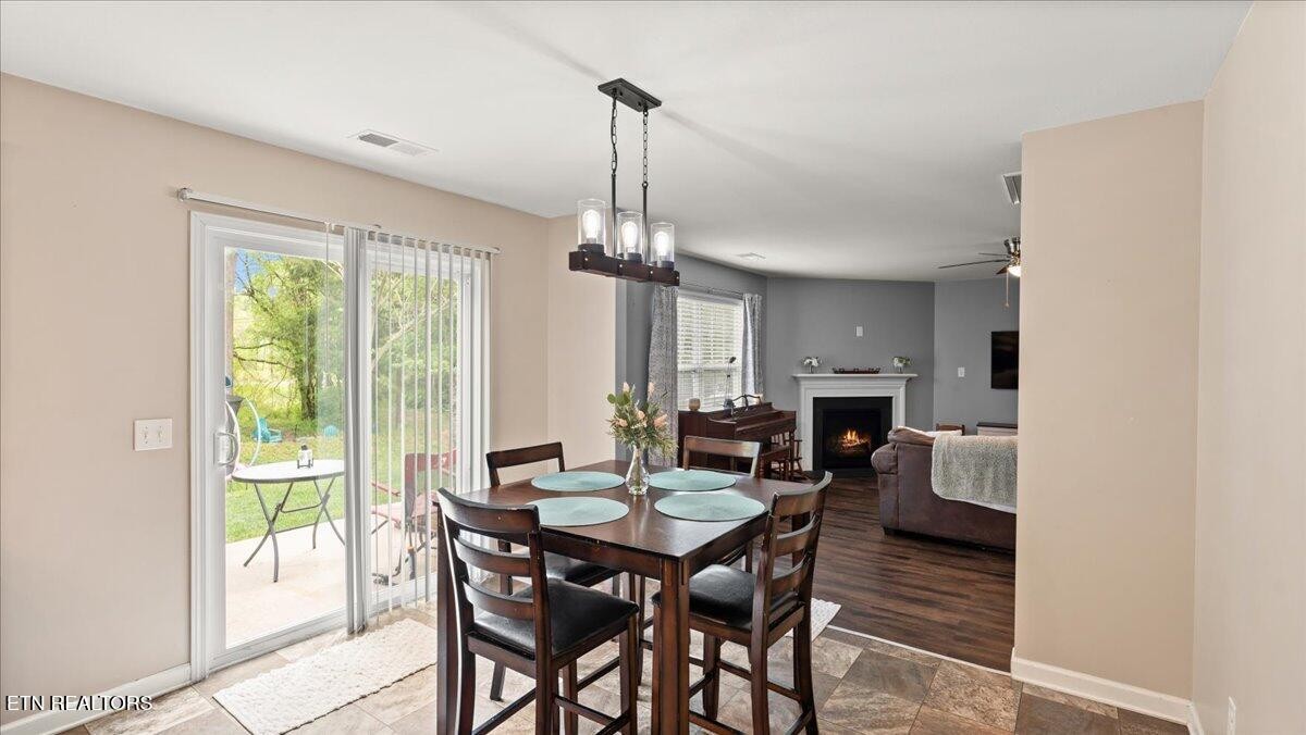 1816 River Poppy Road Mascot, TN 37806 - Photo 16 of 52 a view of a dining room with furniture window and outside view
