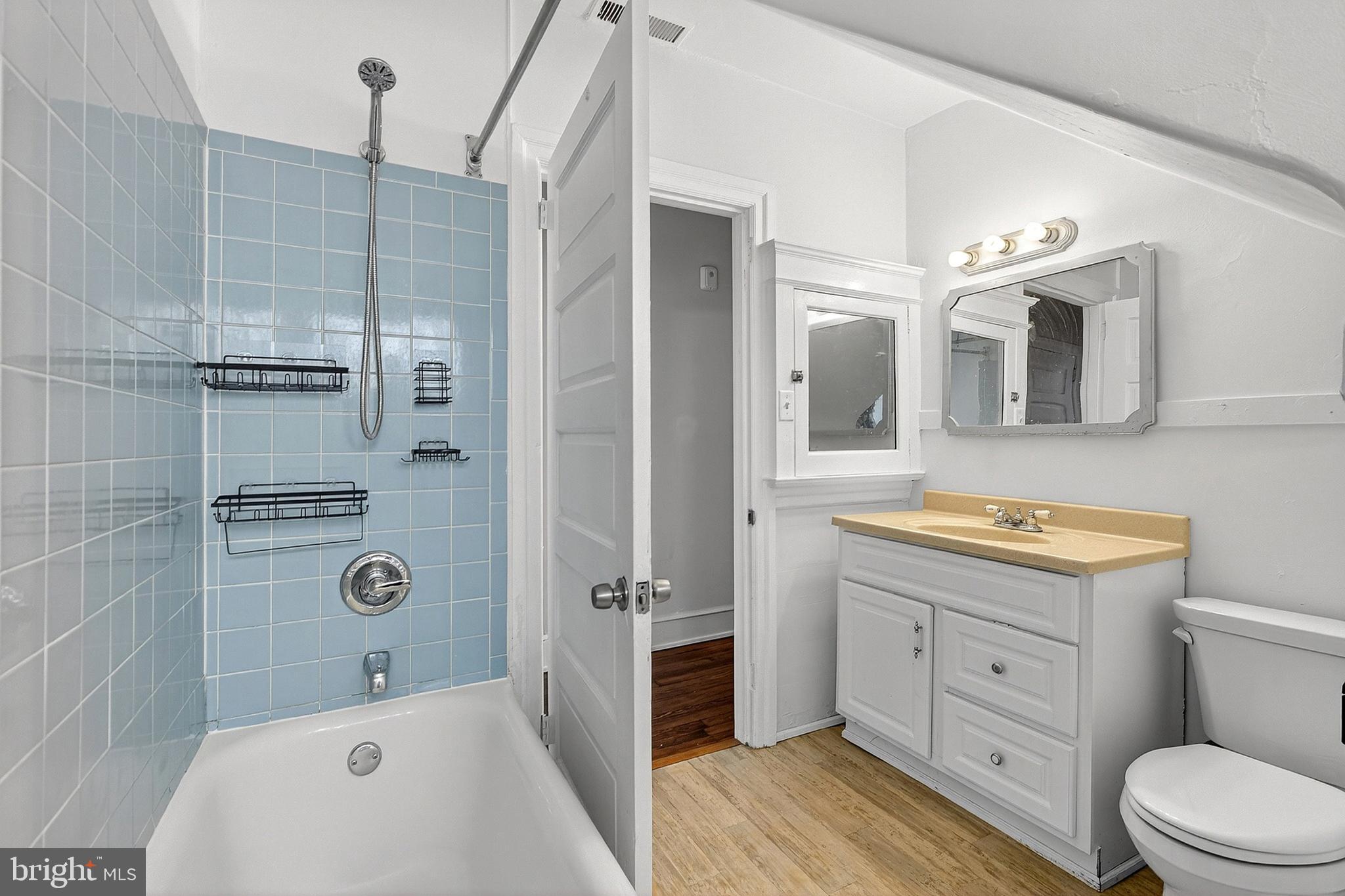 5506 Greene Street Philadelphia, PA 19144 - Photo 14 of 17 a bathroom with a granite countertop bathtub shower sink mirror and toilet