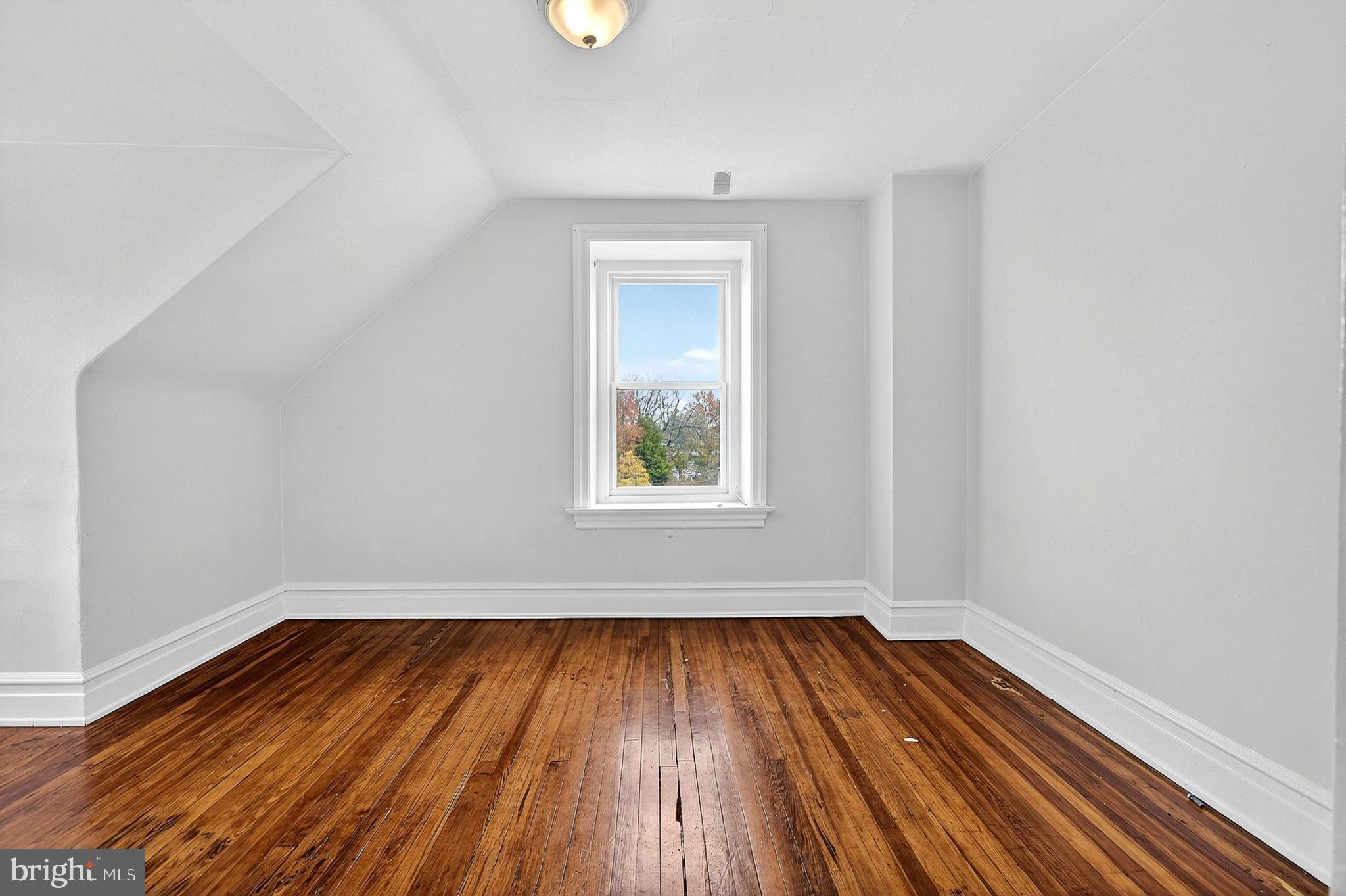 5506 Greene Street Philadelphia, PA 19144 - Photo 15 of 17 a view of a room with wooden floors and window