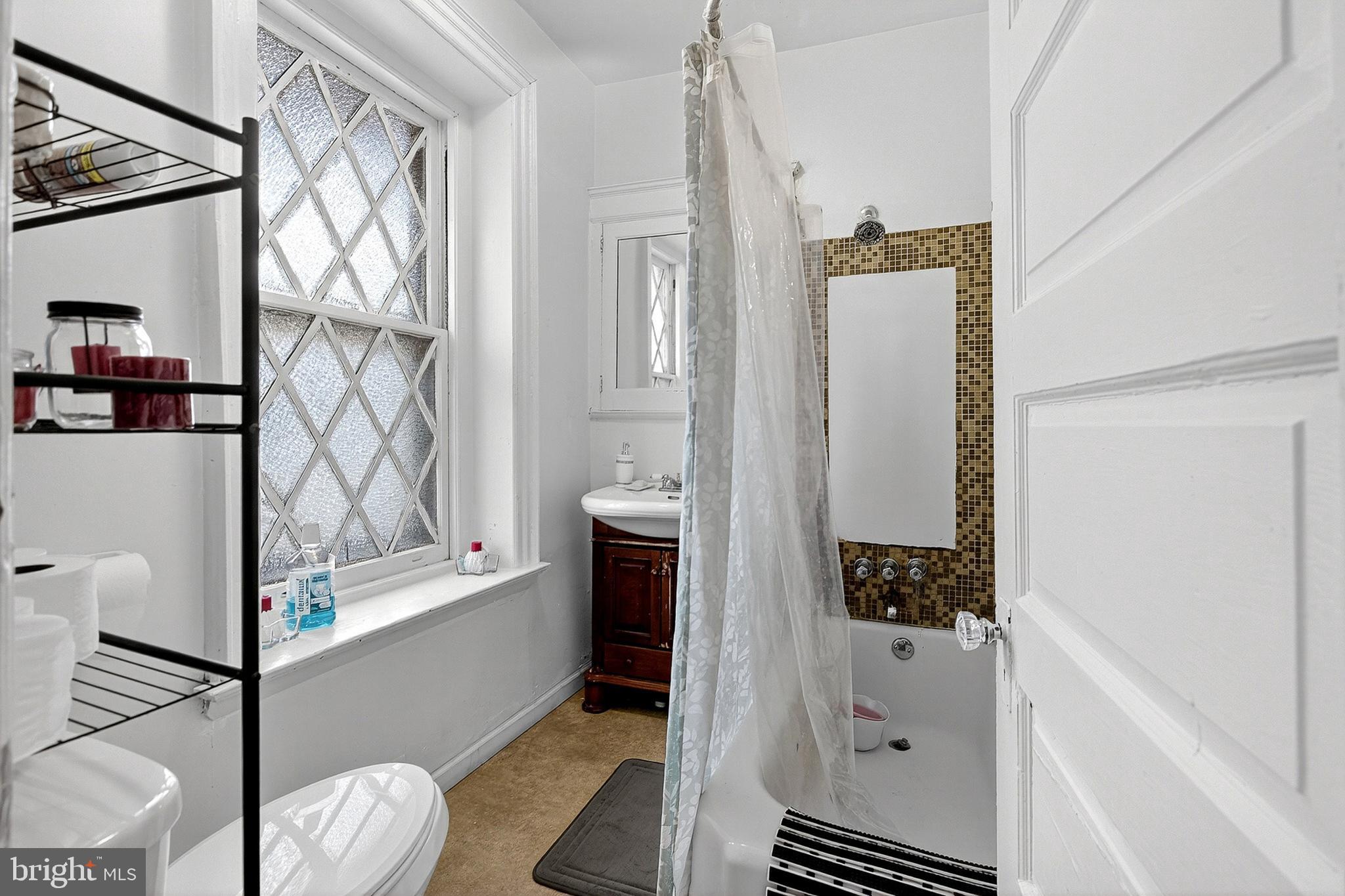 5506 Greene Street Philadelphia, PA 19144 - Photo 6 of 17 a bathroom with a bathtub and shower