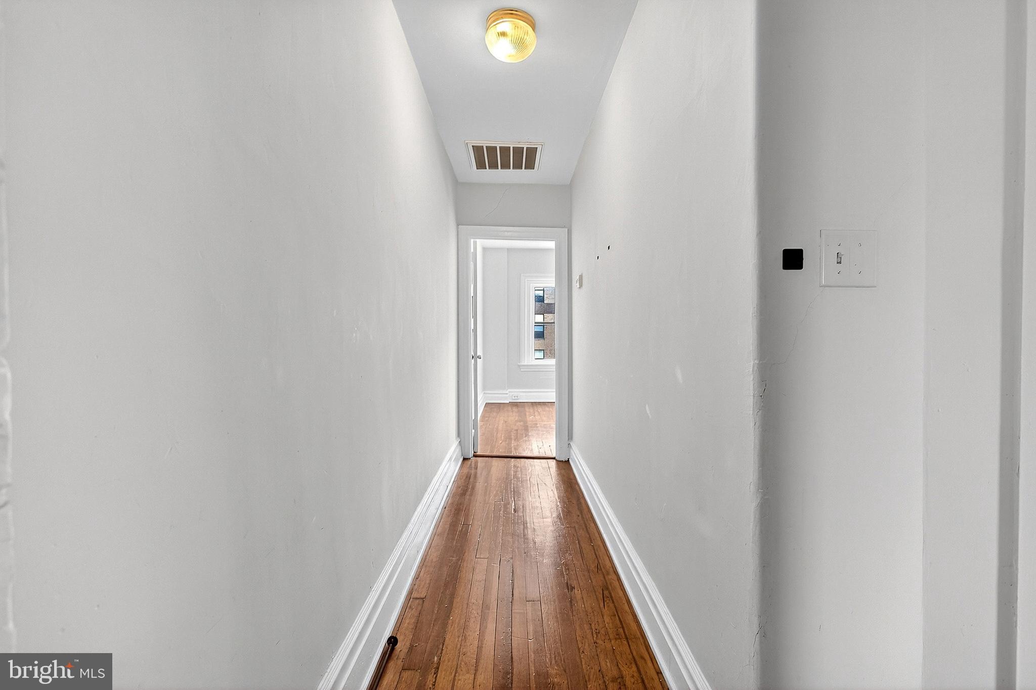 5506 Greene Street Philadelphia, PA 19144 - Photo 10 of 17 a view of a hallway with wooden floor