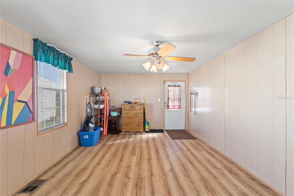 251 Patterson Road, Unit J19 Haines City, FL 33844 - Photo 17 of 30 a view of a room with wooden floor and windows
