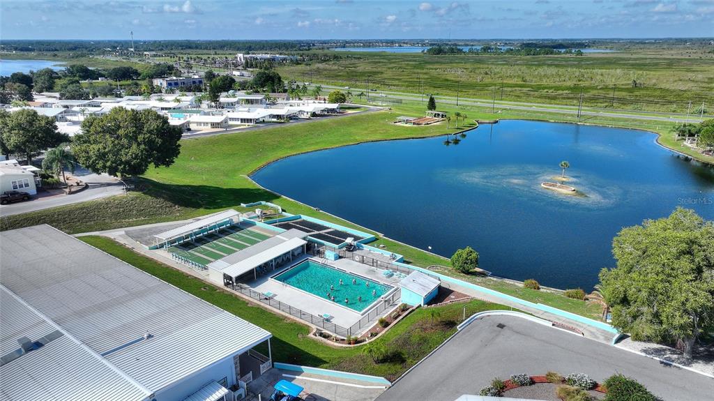 251 Patterson Road, Unit J19 Haines City, FL 33844 - Photo 20 of 30 an aerial view of a house with a garden and lake view